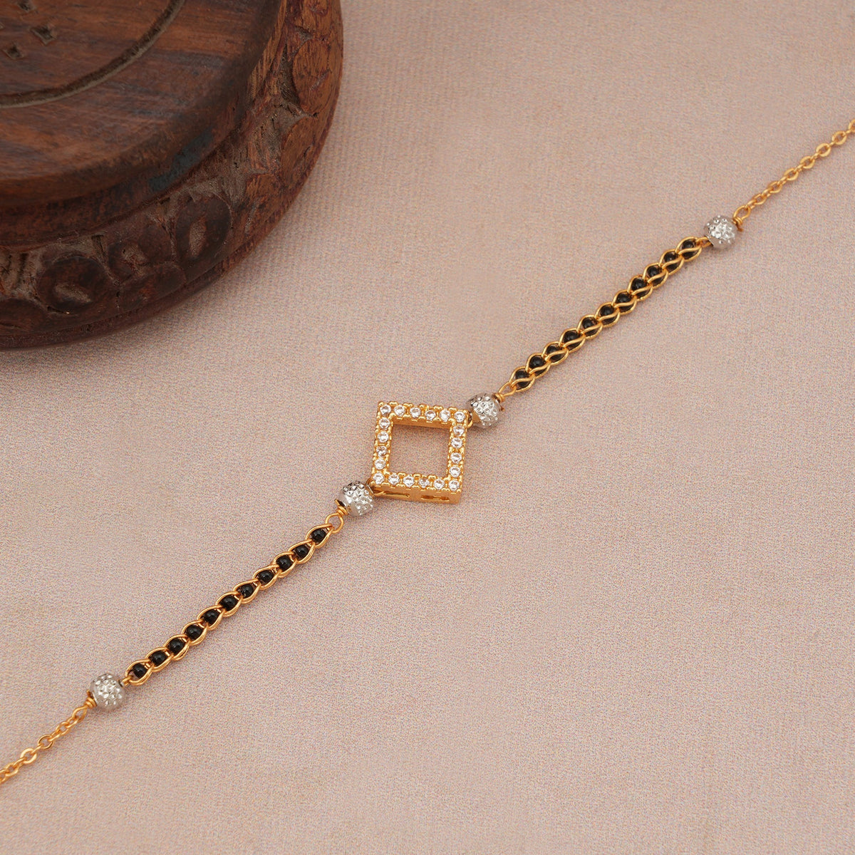 Cute sleek diamond antique gold mangalsutra bracelet