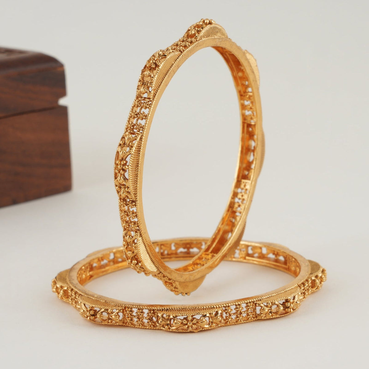 Plain intricate gold bangle set