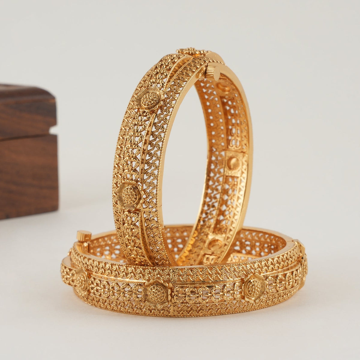 Beautiful intricate broad gold bangle set