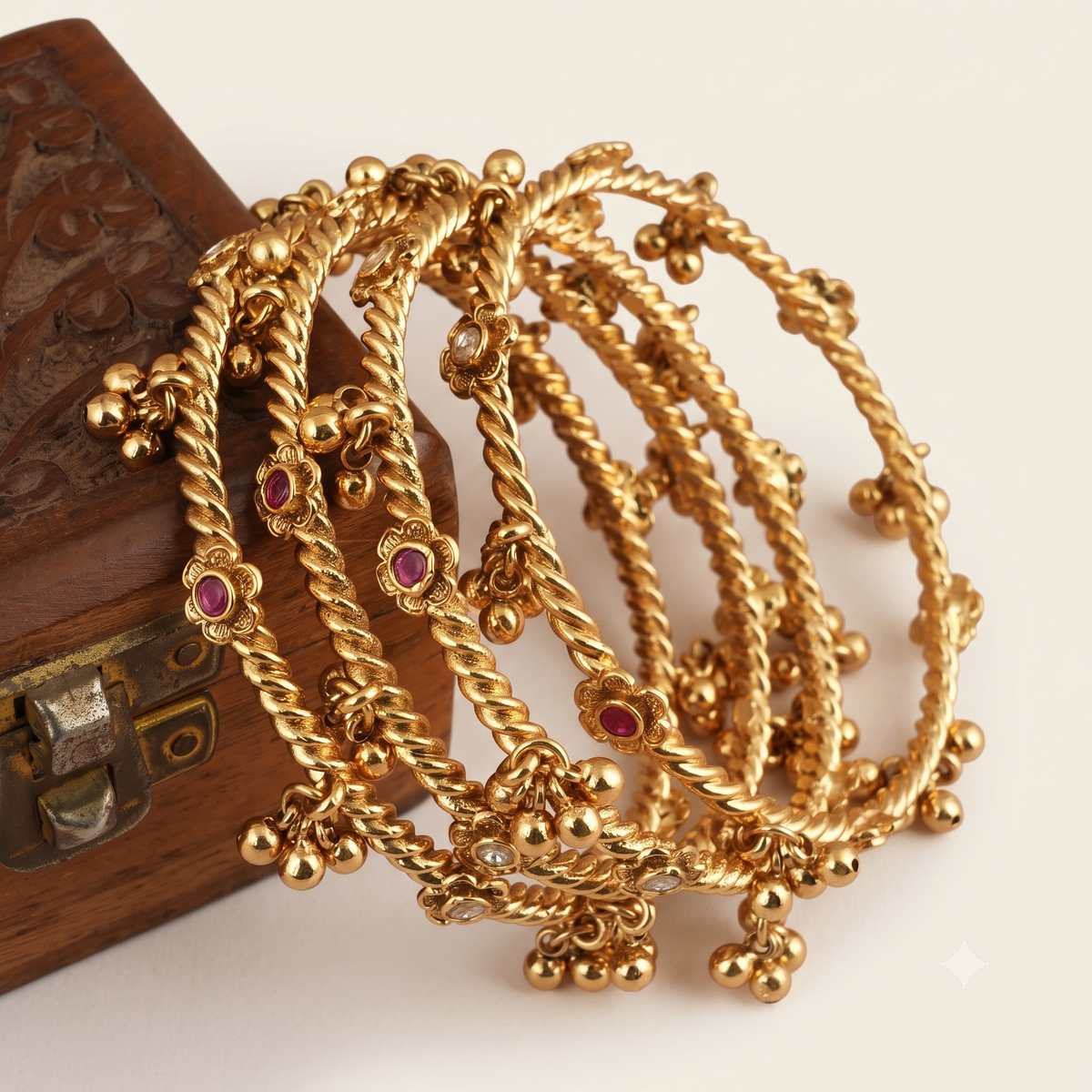 Beautiful antique gold stone ghungroo bangle set ( set of 4 )